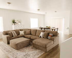 Living room with wood finished floors and baseboards