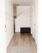 Hall with light wood-type flooring