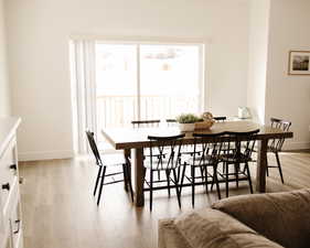 Dining room featuring baseboards and light wood-type flooring