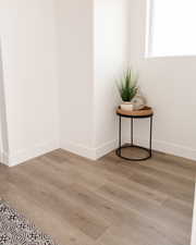 Detailed view of wood finished floors and baseboards