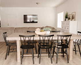 Dining area with light wood finished floors