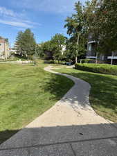 View of community featuring a lawn