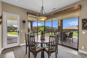 Dining area with plenty of natural light and light wood finished floors