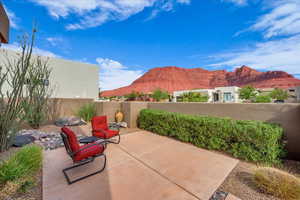 Fenced backyard with a patio and a mountain view