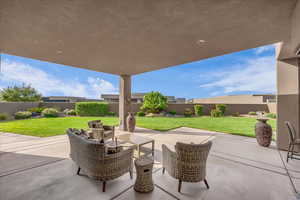 Fenced backyard featuring a patio