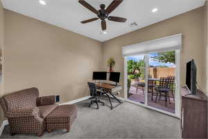 Carpeted office featuring recessed lighting and ceiling fan