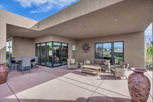 View of patio / terrace featuring an outdoor living space and outdoor dining area