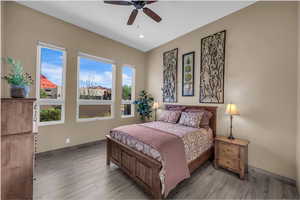 Bedroom featuring light wood-type flooring, ceiling fan, and recessed lighting