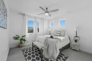Bedroom with carpet and a ceiling fan