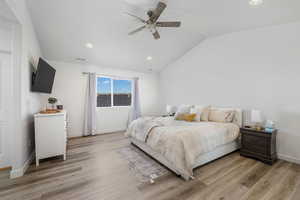 Bedroom featuring lofted ceiling, ceiling fan, recessed lighting, and light wood-style flooring