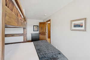 Bedroom featuring a textured ceiling