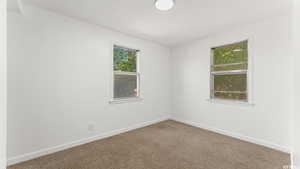 Spare room with carpet flooring and baseboards