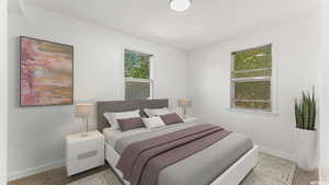 Carpeted bedroom with baseboards