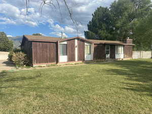 View of front of home with a chimney