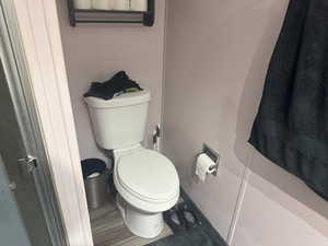 Bathroom with toilet and baseboards