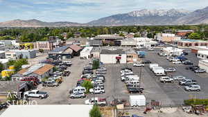 Aerial view of a mountainous background and a commercial area