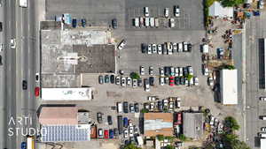 Aerial view of property's location with an industrial area