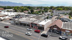 Bird's eye view of a mountainous background and a commercial area