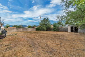 View of fenced backyard