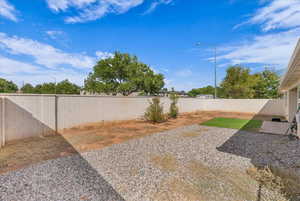 View of fenced backyard