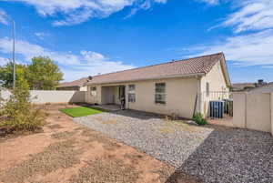 Back of house with a patio, stucco siding, and a tile roof