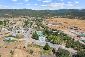 Aerial view of property's location with mountains and a pool