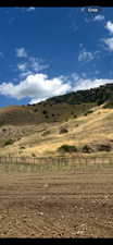 View of mountain backdrop with rural landscape
