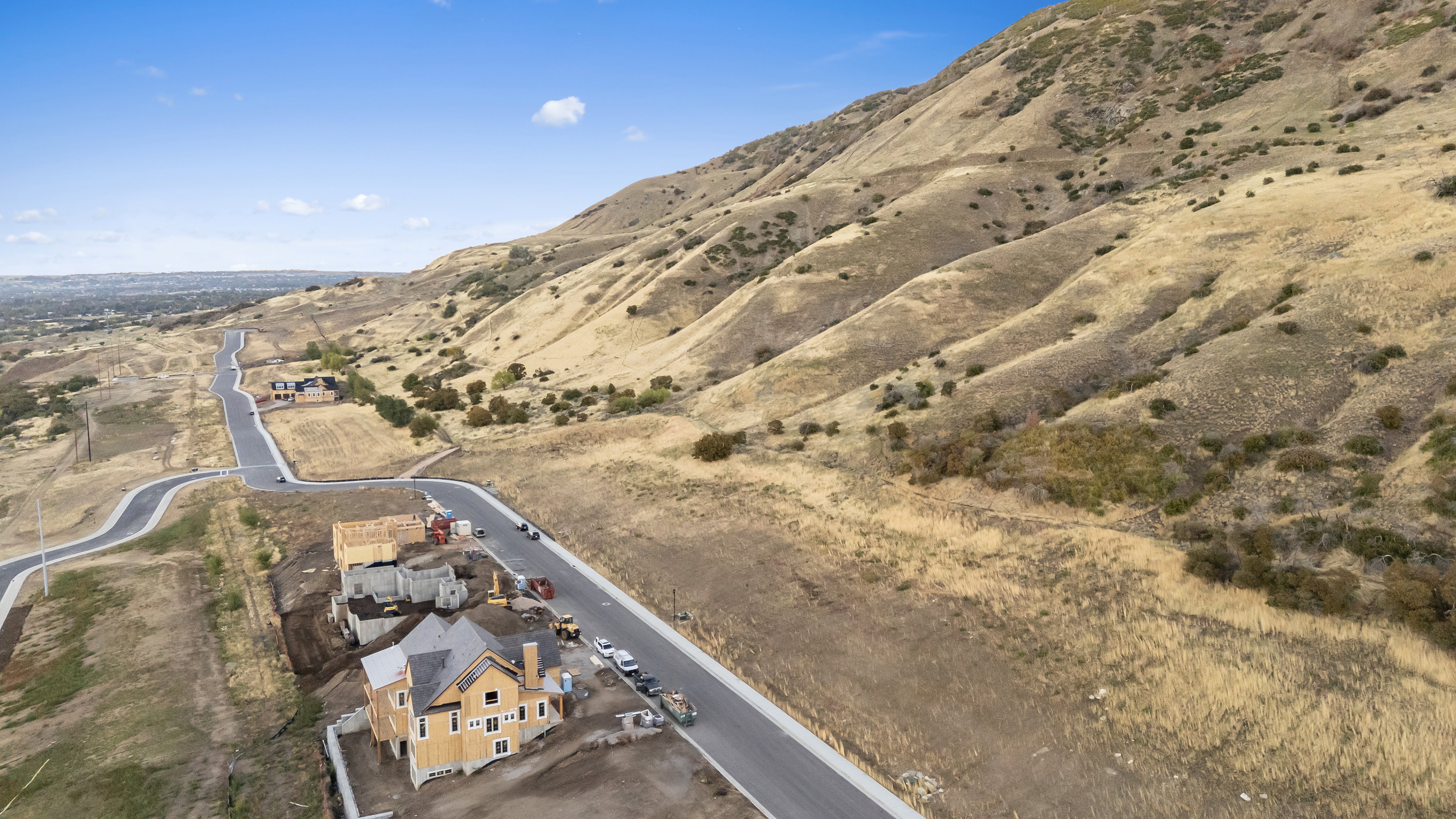 Aerial overview of property's location with a mountainous background