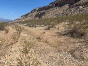 View of mountain background featuring rural landscape