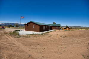 Rear view of house with a mountain view