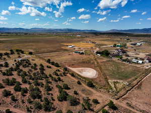 Aerial view of property's location featuring rural landscape and a mountain backdrop