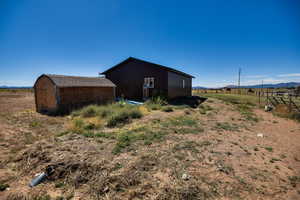 View of pole building with a view of countryside and a mountain view