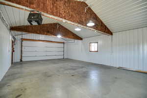Garage with metal wall and a garage door opener
