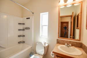 Bathroom featuring bathing tub / shower combination and vanity