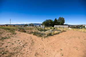 View of yard featuring a view of countryside and a mountain view