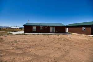 Rear view of house with a metal roof