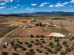 Aerial view of property and surrounding area with rural landscape
