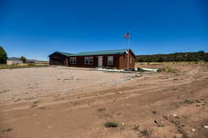 Back of house with a porch