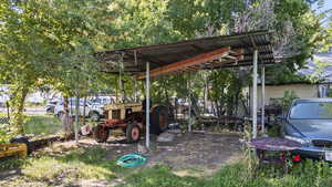 View of yard with a detached carport