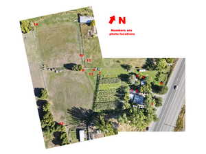 Aerial view of sparsely populated area with large plots for crops