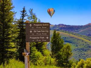 Community sign featuring a mountain view