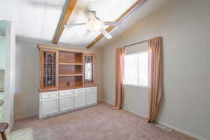 Unfurnished room with light carpet and a ceiling fan