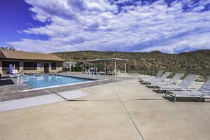 Community pool featuring a patio area and a mountain view
