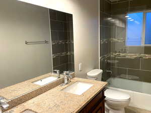 Full bath with washtub / shower combination and double vanity