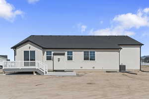 Rear view of property with a patio area, roof with shingles, a deck, and stucco siding