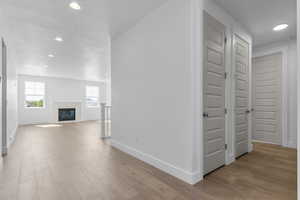 Hall with recessed lighting and light wood finished floors