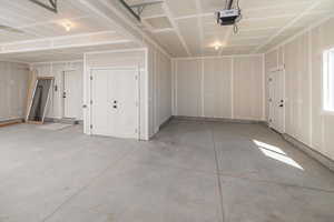 Garage featuring a garage door opener