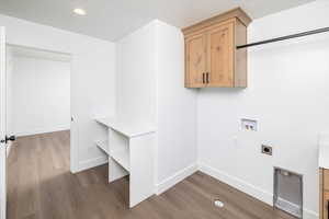 Laundry room with washer hookup, dark wood-type flooring, recessed lighting, and hookup for an electric dryer