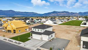 Aerial perspective of suburban area featuring a mountainous background