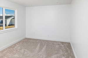 Empty room with carpet flooring